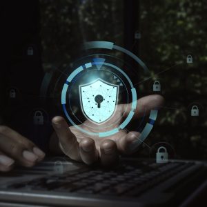 Secure data, Internet security data protection with business technology privacy concept. Safety virtual icon, shield, padlock on cyber network connection in businessman's hand while using laptop.